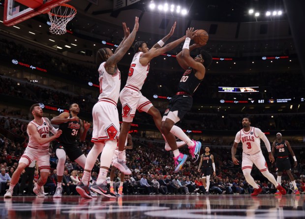 Chicago Bulls forward Dalen Terry (25) blocks a shot by Portland Trail Blazers guard Scoot Henderson (00) in the second half Monday, March 18, 2024, at the United Center. (Brian Cassella/Chicago Tribune)