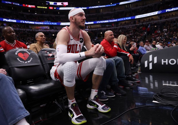 Chicago Bulls guard Alex Caruso (6) ends up in the front row of seats after a play in the second half Monday, March 18, 2024, at the United Center. (Brian Cassella/Chicago Tribune)