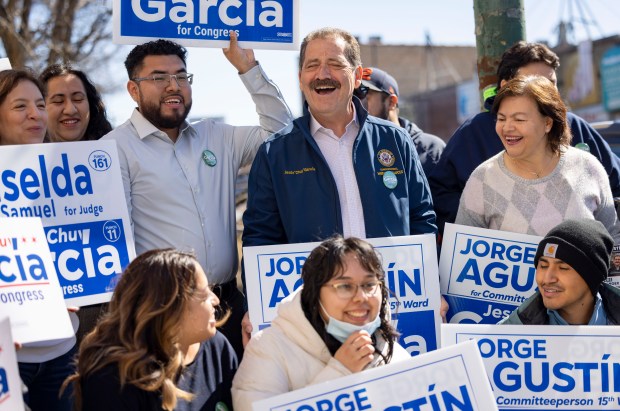 U.S. Rep. Jesús "Chuy" García, 4th, center, rallies with campaign volunteers and other elected officials before a canvassing on March 10, 2024, in Brighton Park. (Brian Cassella/Chicago Tribune)