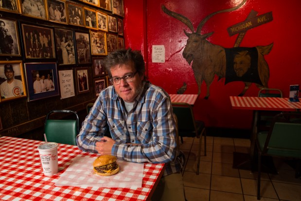 George Motz with a triple cheeseburger at the Billy Goat Tavern in Chicago, April 4, 2013, is America's leading hamburger expert. (Zbigniew Bzdak/Chicago Tribune)