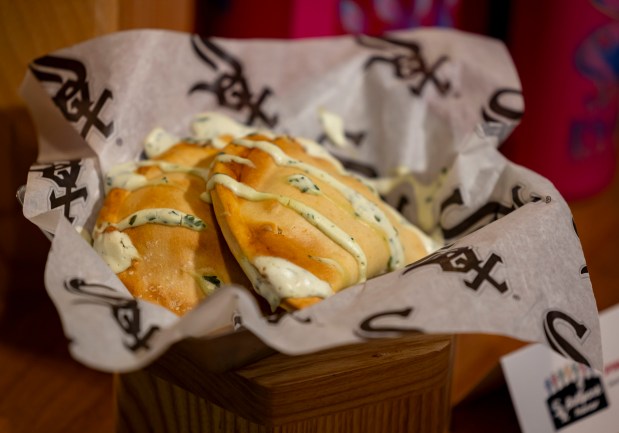 The spinach empanadas with cilantro lime crema available in Section 140 as the White Sox preview new food offerings Thursday, March 21, 2024, at Guaranteed Rate Field. (Brian Cassella/Chicago Tribune)