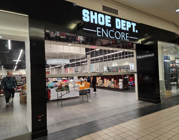 Shoe Dept. Encore was one of the few stores still open at Spring Hill Mall Friday, which was its last day open. The West Dundee/Carpentersville shopping center is going to be redeveloped by the village of West Dundee, and any remaining store leases were terminated effective Friday, officials said. (Gloria Casas/The Courier-News)