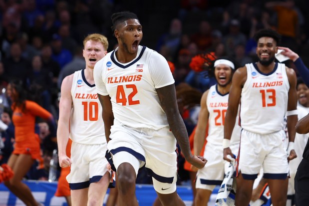 Illinois forward Dain Dainja (42) celebrates after a dunk against Morehead State in the first round of the NCAA Tournament on March 21, 2024, in Omaha, Neb. Dainja scored 21 points on 9-for-9 shooting in the Illini's 85-69 victory. (John Peterson/AP)