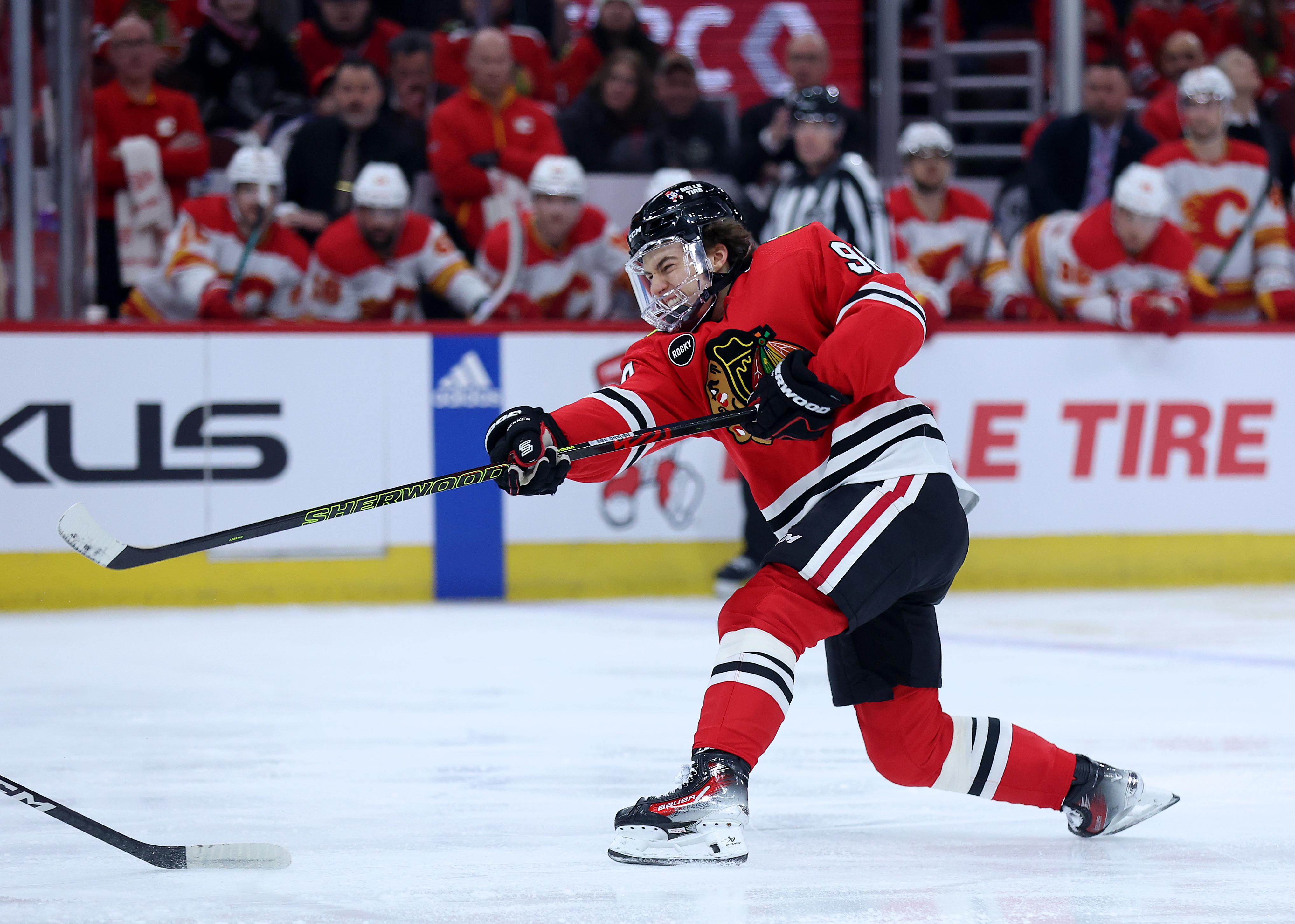 Chicago Blackhawks center Connor Bedard (98) takes a shot in the first period of a game against the Calgary Flames at the United Center in Chicago on March 26, 2024. (Chris Sweda/Chicago Tribune)