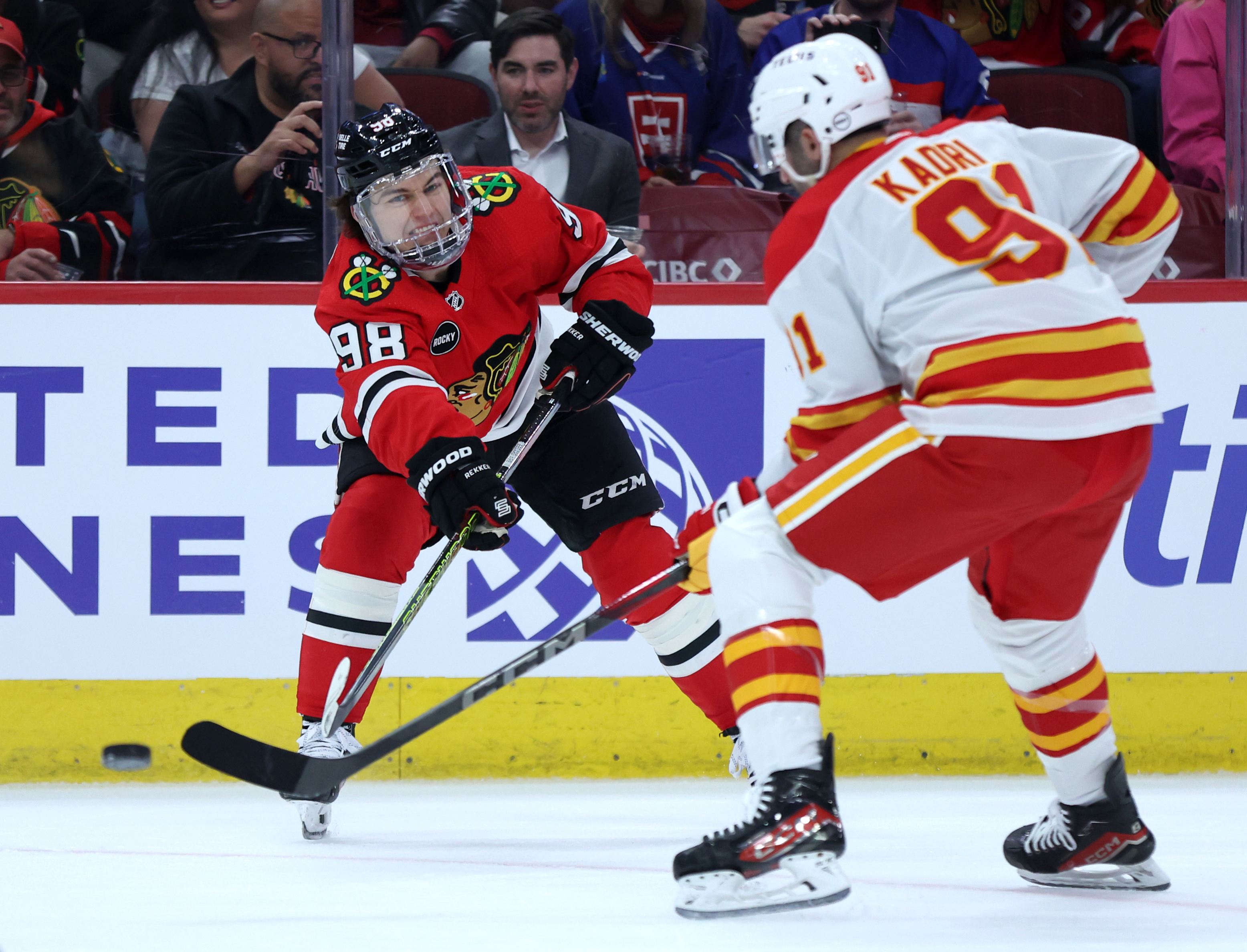 Chicago Blackhawks center Connor Bedard (98) makes a pass in the first period of a game against the Calgary Flames at the United Center in Chicago on March 26, 2024. (Chris Sweda/Chicago Tribune)