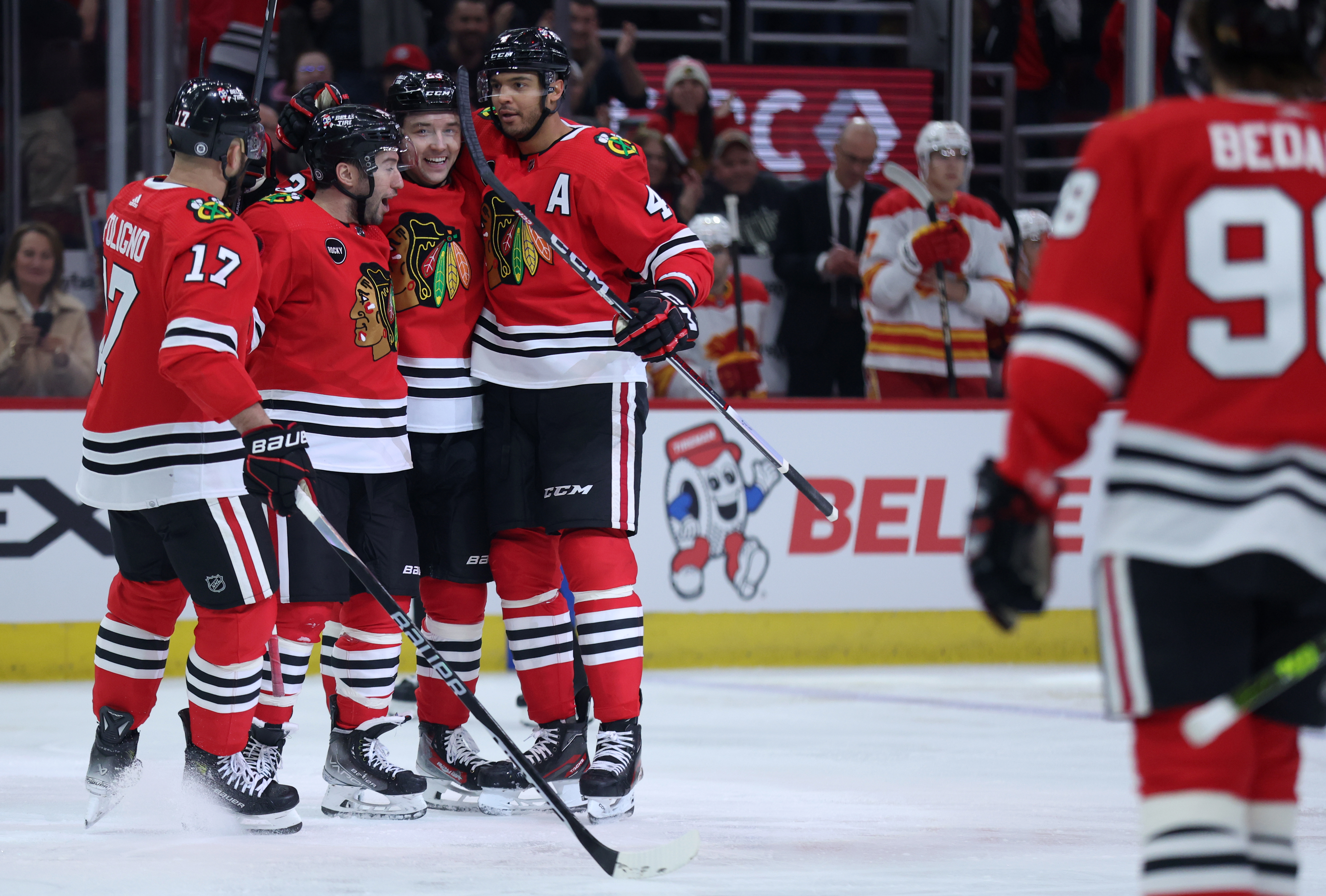 Chicago Blackhawks defenseman Seth Jones (right) celebrates with his teammates after scoring a goal in the first period of a game against the Calgary Flames at the United Center in Chicago on March 26, 2024. (Chris Sweda/Chicago Tribune)