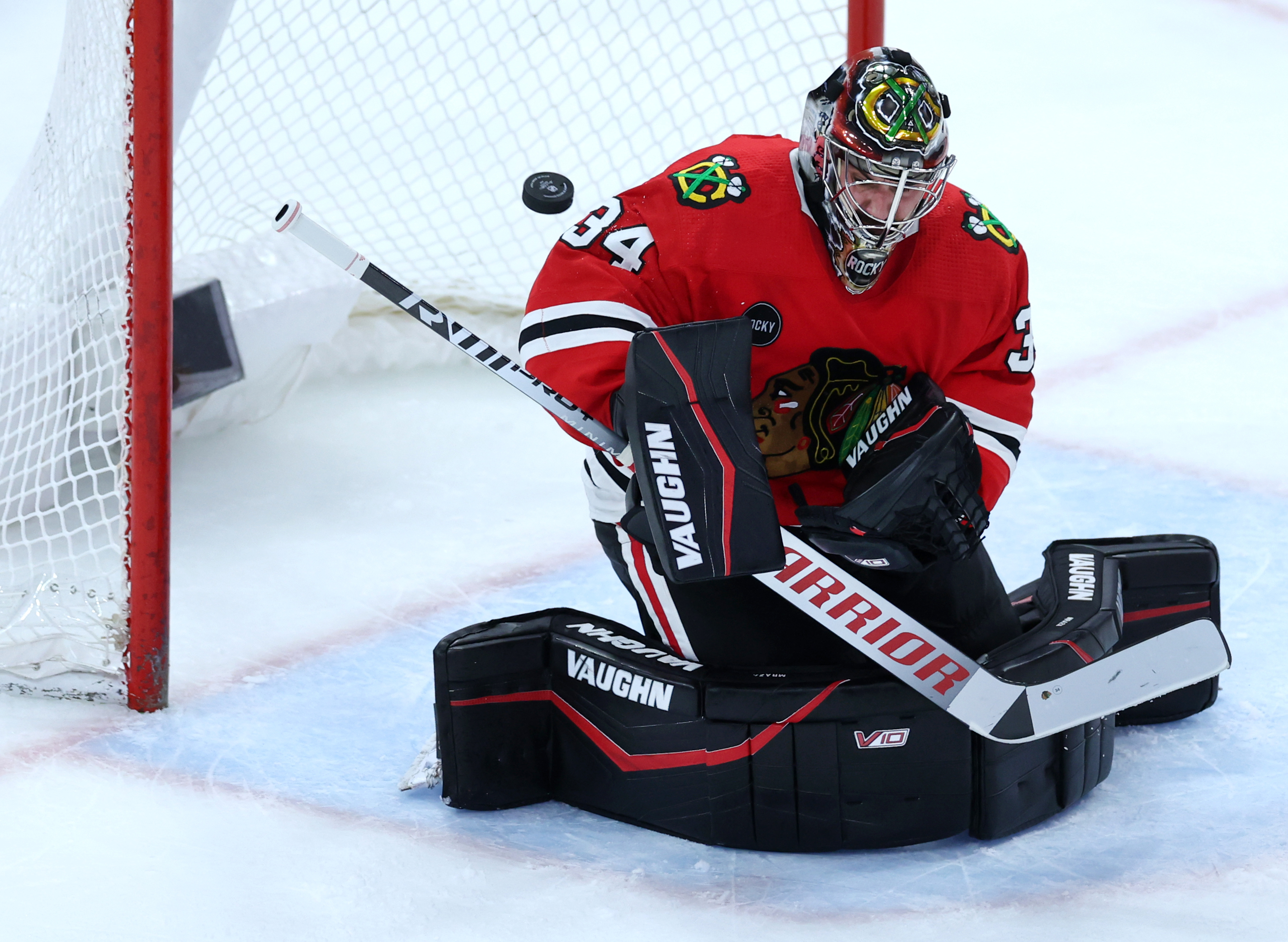 Chicago Blackhawks goaltender Petr Mrazek (34) blocks a away a shot in the second period of a game against the Calgary Flames at the United Center in Chicago on March 26, 2024. (Chris Sweda/Chicago Tribune)