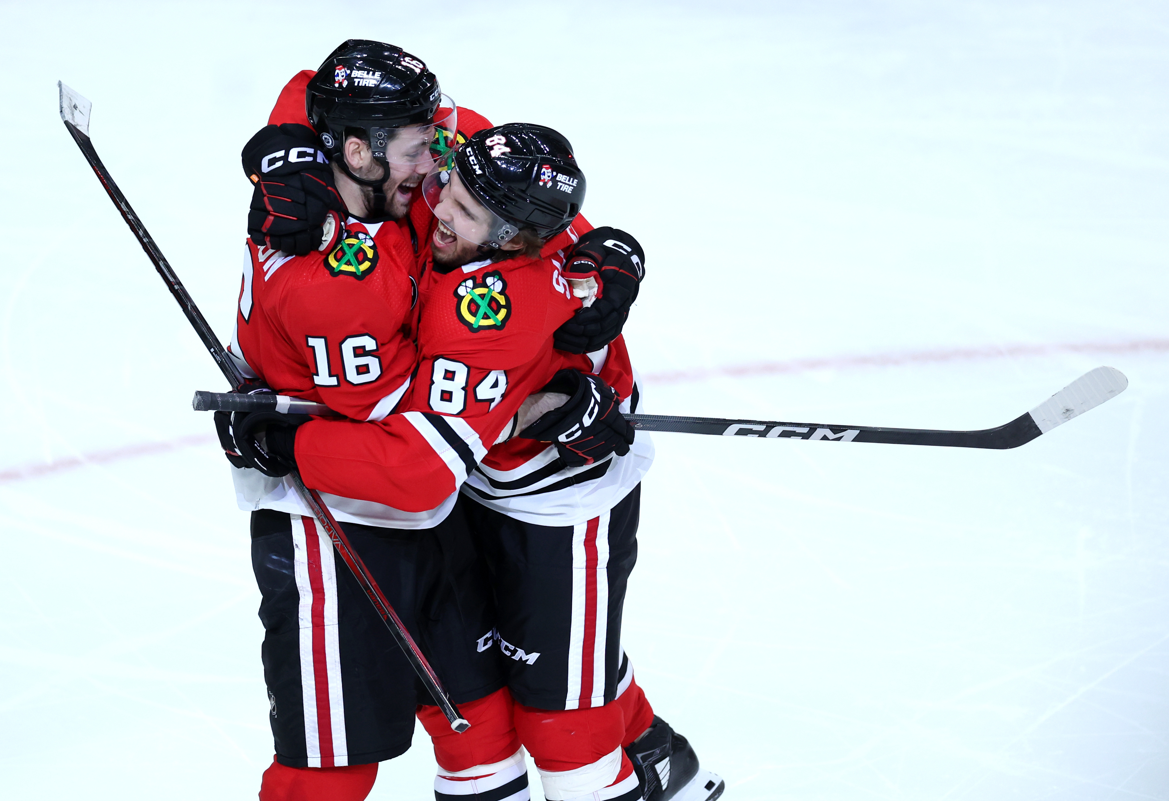 Chicago Blackhawks center Jason Dickinson (16) and left wing Landon Slaggert (84) celebrate after Slaggert thought he scored in the third period of a game against the Calgary Flames at the United Center in Chicago on March 26, 2024. After a review, the goal was disallowed. (Chris Sweda/Chicago Tribune)