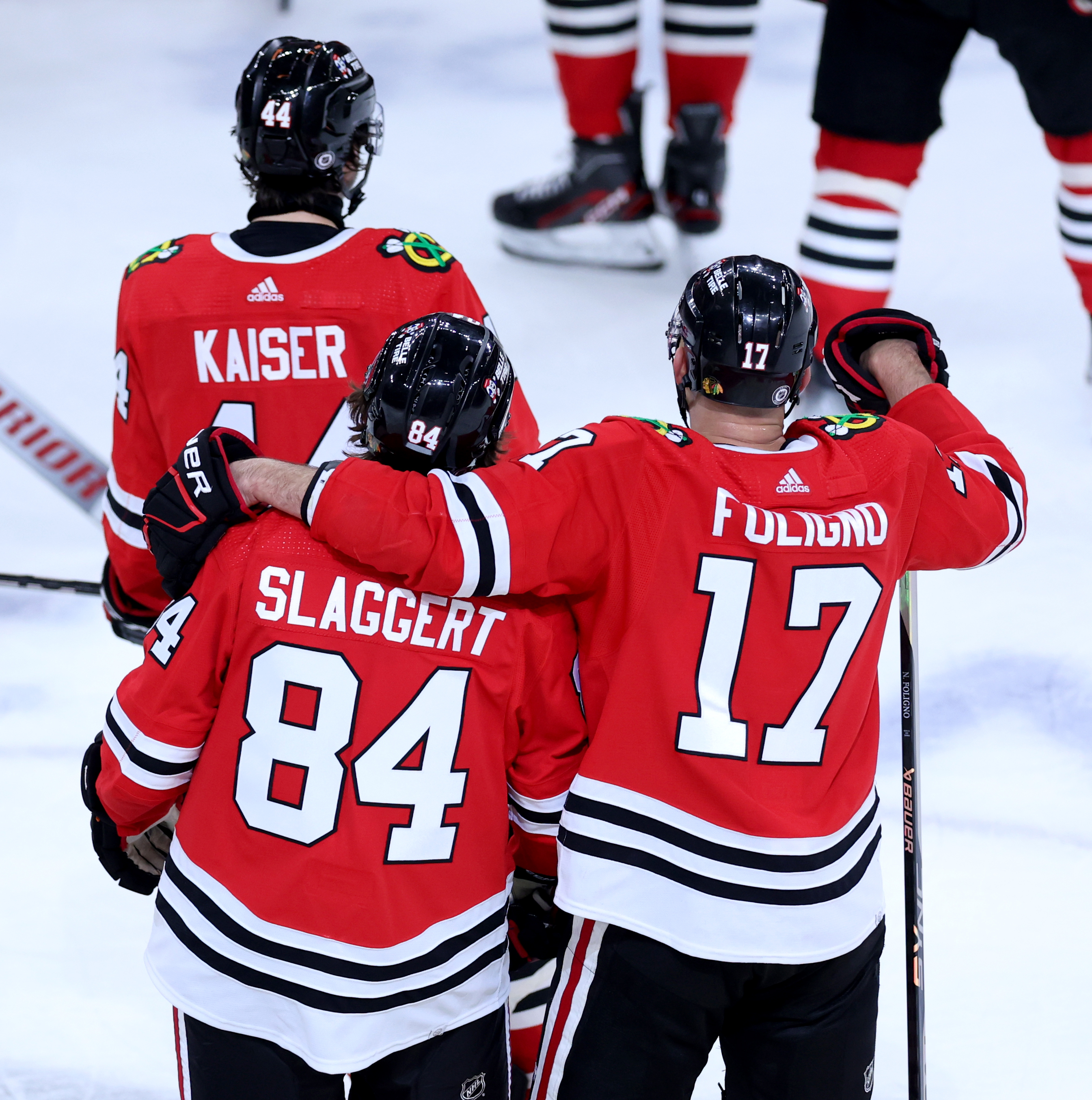 Chicago Blackhawks left wing Nick Foligno (17) puts his arm around teammate Landon Slaggert (84) after a Blackhawks victory over the Calgary Flames at the United Center in Chicago on March 26, 2024. (Chris Sweda/Chicago Tribune)