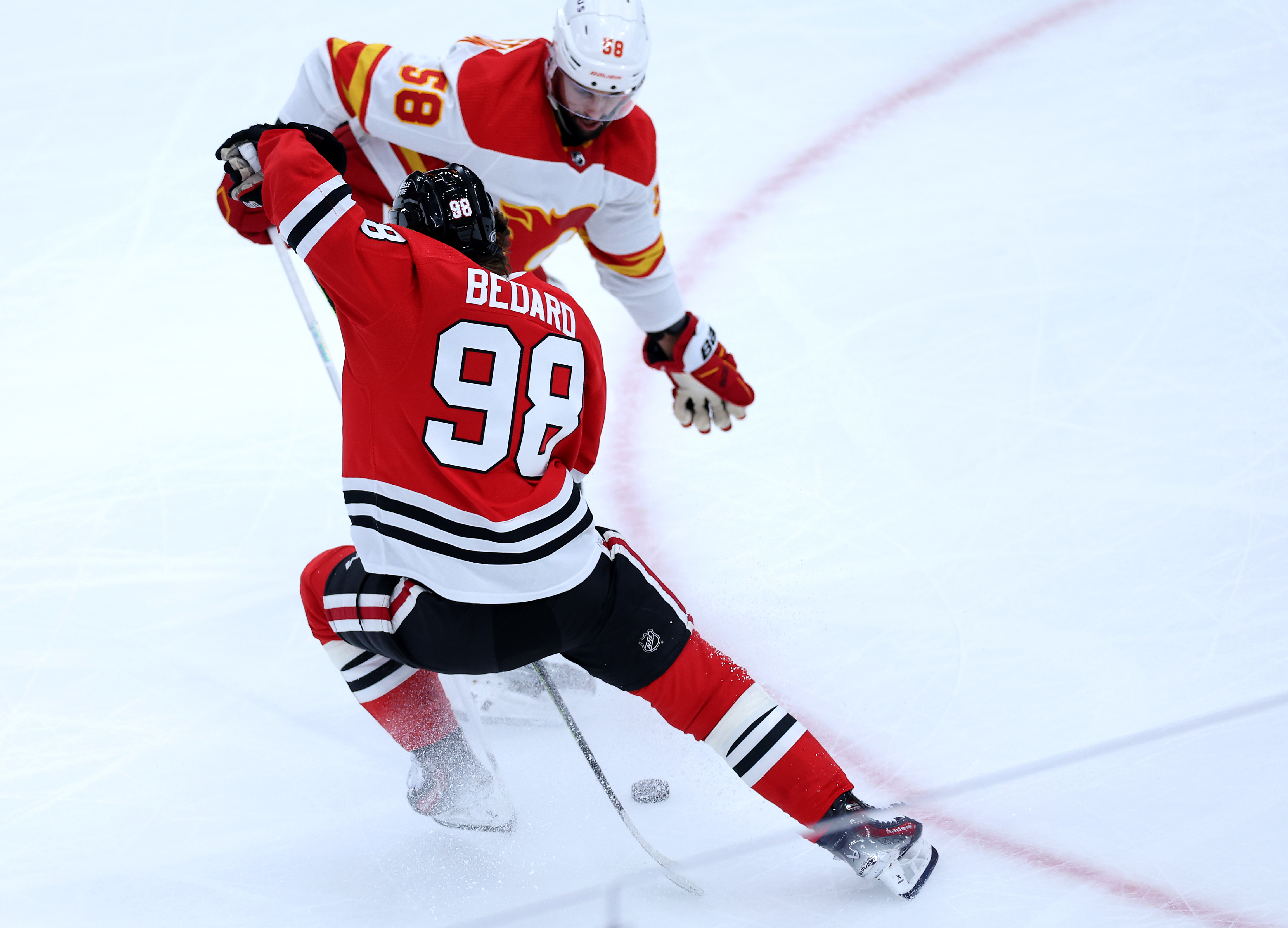 Chicago Blackhawks center Connor Bedard (98) makes a move in the second period of a game against the Calgary Flames at the United Center in Chicago on March 26, 2024. (Chris Sweda/Chicago Tribune)