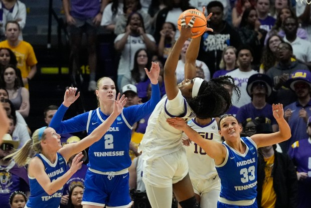 LSU guard Aneesah Morrow (24) battles for a rebound against Middle Tennessee forward Courtney Whitson (33), center Anastasiia Boldyreva (2) and guard Jalynn Gregory during the first half of a second-round college basketball game in the women's NCAA Tournament in Baton Rouge, La., Sunday, March 24, 2024. (AP Photo/Gerald Herbert)