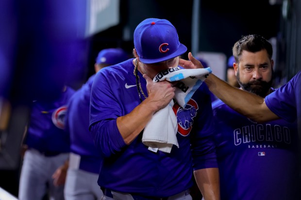 Chicago Cubs starting pitcher Justin Steele, center, leaves after injuring his left leg during the fifth inning of the team's baseball game against the Texas Rangers, Thursday, March 28, 2024 in Arlington, Texas. (AP Photo/Gareth Patterson)