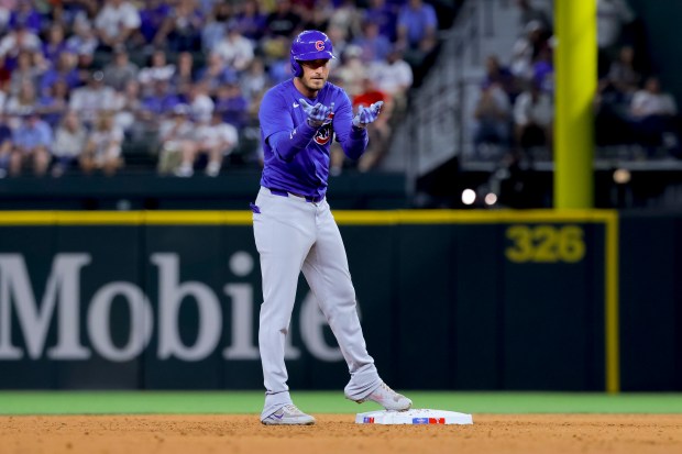 Cubs center fielder Cody Bellinger celebrates after hitting an RBI double in the sixth inning against the Rangers on March 28, 2024, in Arlington, Texas. (Gareth Patterson/AP)