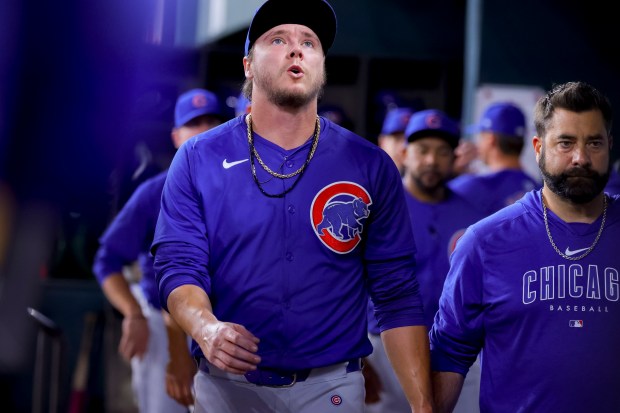 Chicago Cubs starting pitcher Justin Steele, center, leaves after injuring his left leg during the fifth inning of the team's baseball game against the Texas Rangers, Thursday, March 28, 2024 in Arlington, Texas. (AP Photo/Gareth Patterson)