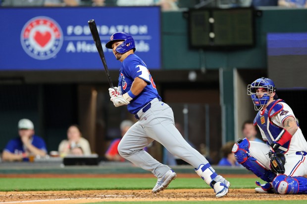 ARLINGTON, TEXAS - MARCH 28: Seiya Suzuki #27 of the Chicago Cubs hit a double during the sixth inning of the Opening Day game against the Texas Rangers at Globe Life Field on March 28, 2024 in Arlington, Texas. (Photo by Stacy Revere/Getty Images)