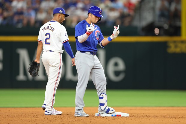 ARLINGTON, TEXAS - MARCH 28: Seiya Suzuki #27 of the Chicago Cubs reacts to a double during the sixth inning of the Opening Day game against the Texas Rangers at Globe Life Field on March 28, 2024 in Arlington, Texas. (Photo by Stacy Revere/Getty Images)
