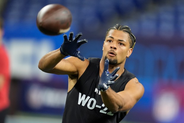 Washington wide receiver Rome Odunze runs a drill at the NFL combine on March 2, 2024. (Michael Conroy/AP)
