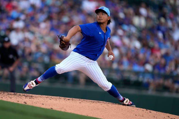 Chicago Cubs starting pitcher Shota Imanaga throws during the second inning of a spring training baseball game against the St. Louis Cardinals, Tuesday, March 26, 2024, in Mesa, Ariz. (AP Photo/Matt York)