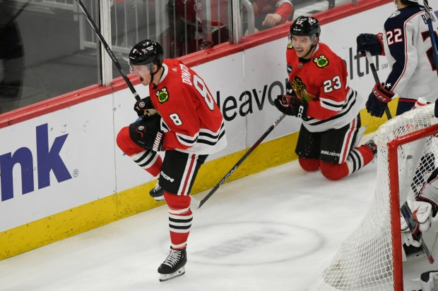 Chicago Blackhawks' Ryan Donato (8) celebrates after scoring a goal during the second period of an NHL hockey game against the Columbus Blue Jackets, Saturday, March 2, 2024, in Chicago. (AP Photo/Paul Beaty)