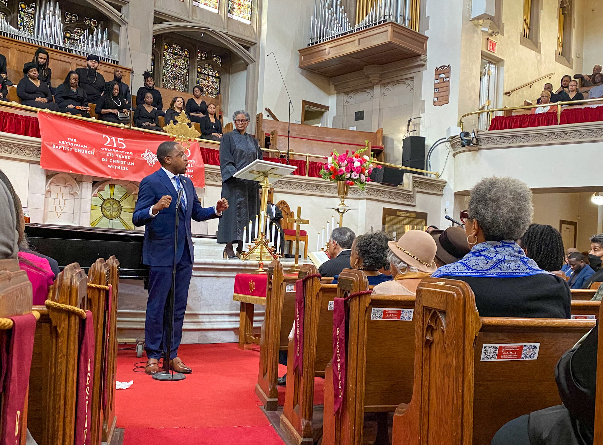 State Senator Zellnor Myrie speaking at a church.