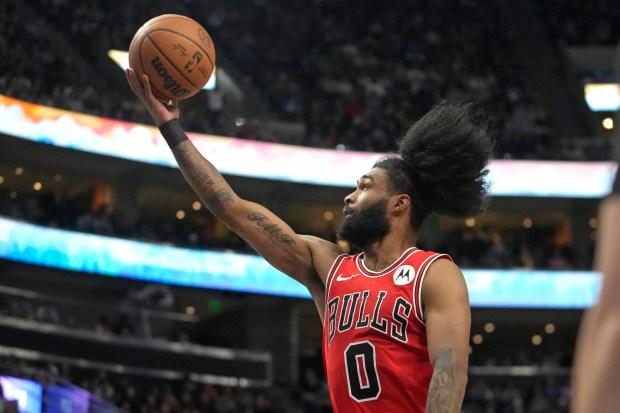Chicago Bulls guard Coby White (0) goes to the basket during the second half of an NBA basketball game against the Utah Jazz Wednesday, March 6, 2024, in Salt Lake City. (AP Photo/Rick Bowmer)