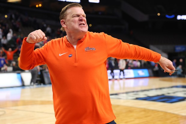 Coach Brad Underwood is fired up after Illinois' rout of Duquesne in the second round of the NCAA Tourmament on March 23, 2024, in Omaha, Neb. (Michael Reaves/Getty)