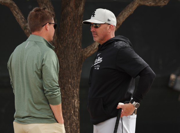 White Sox GM Chris Getz, left, and manager Pedro Grifol talk after practice on Feb. 21, 2024, at Camelback Ranch in Glendale, Arizona. (Stacey Wescott/Chicago Tribune)