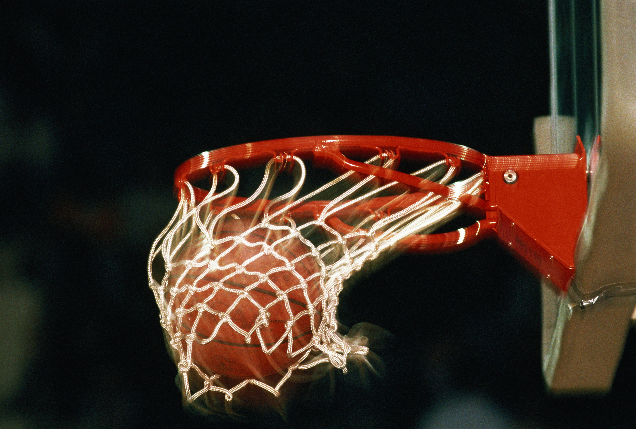 a basketball going through a hoop