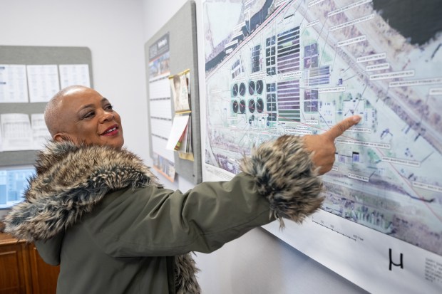 Rhonda Anderson, the new executive director of the Gary Sanitary District, points to a map of the city's water treatment facility on Wednesday, March 27, 2024. (Kyle Telechan/for the Post-Tribune)