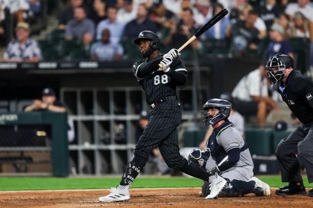 White Sox center fielder Luis Robert Jr. hits a solo home run against the Yankees on Aug. 8, 2023, at Guaranteed Rate Field. (Armando L. Sanchez/Chicago Tribune)