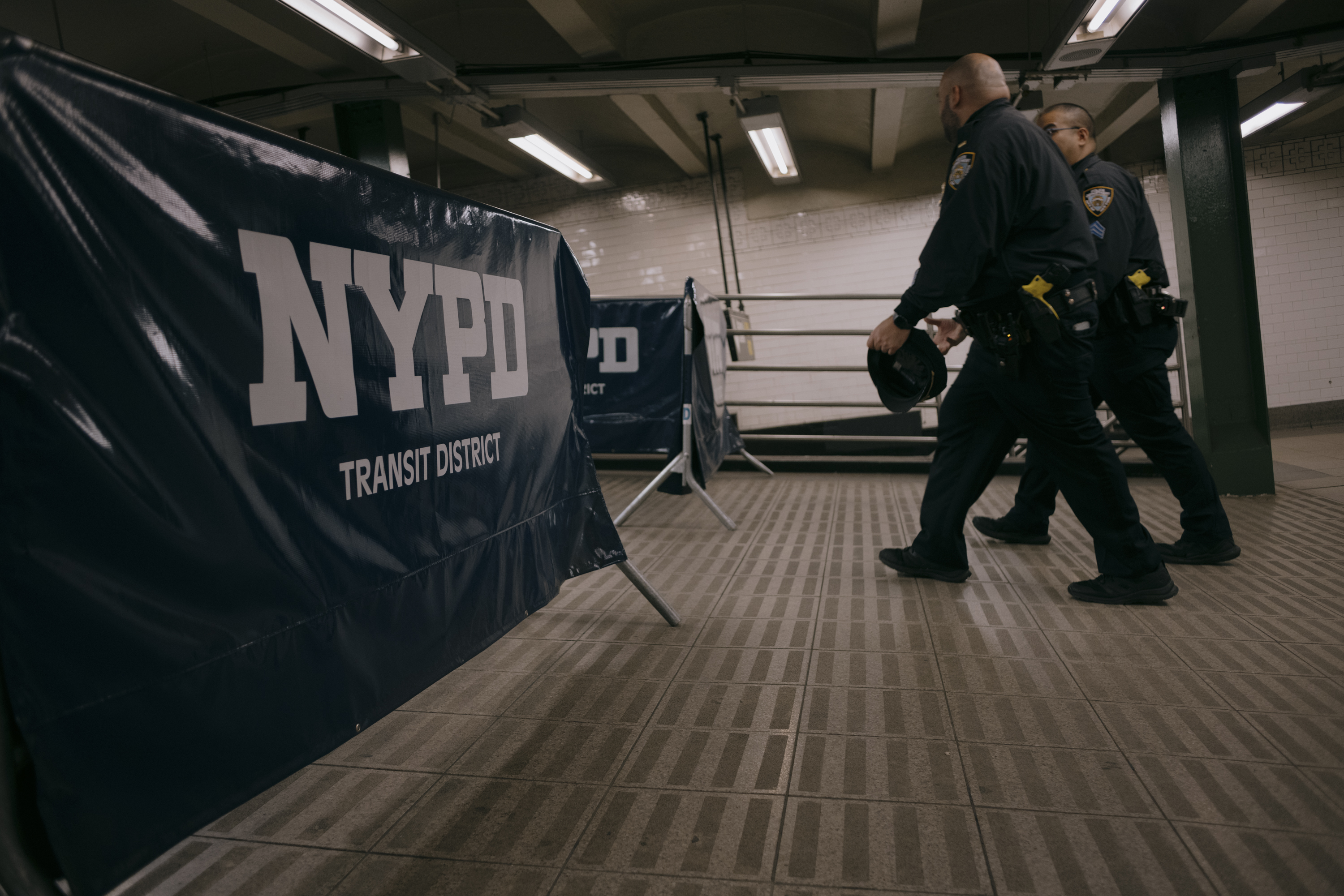 Police patrol a subway station.