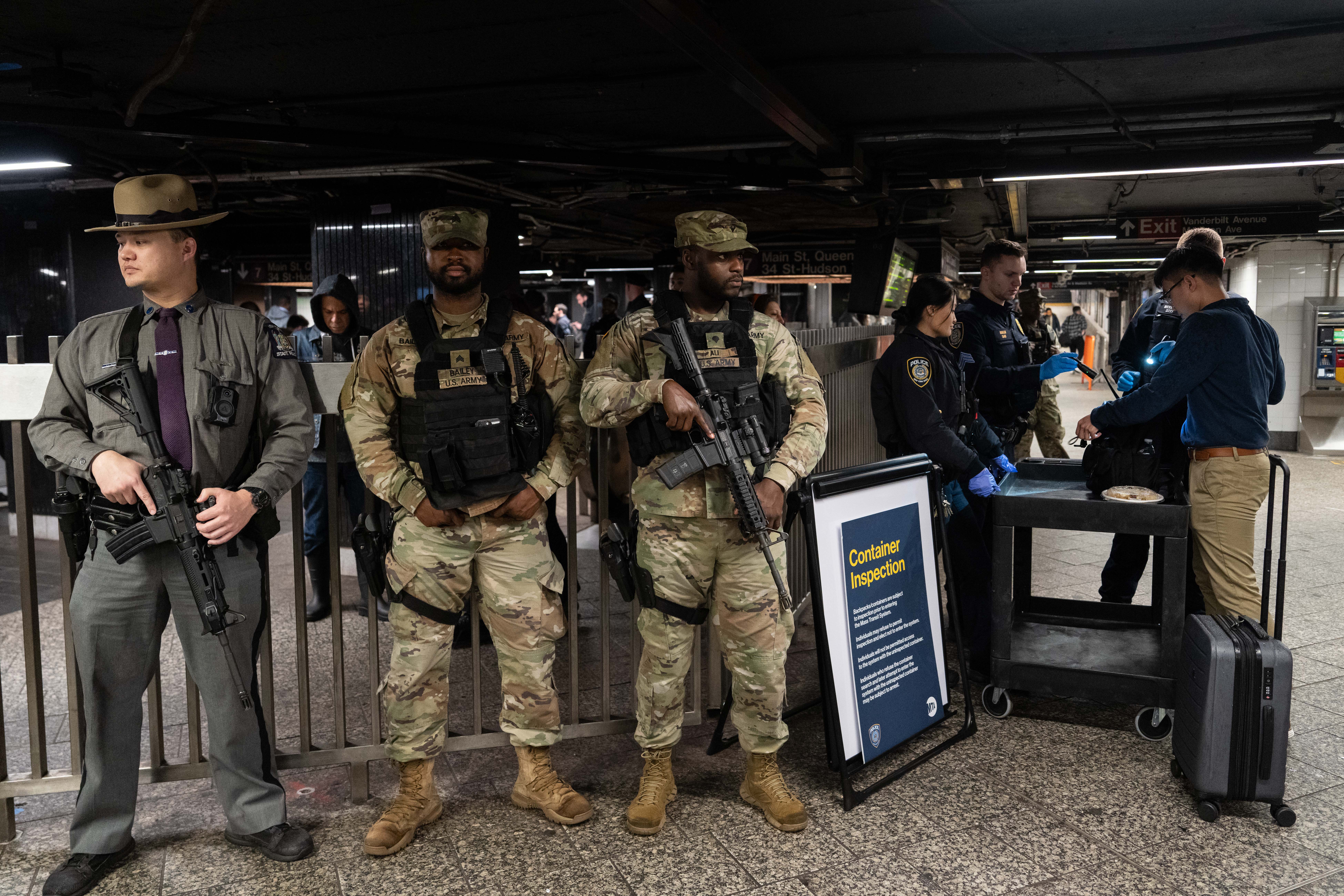 New York State police, MTAPD and the New York National Guard patrol and conduct container inspections at Grand Central Station.
