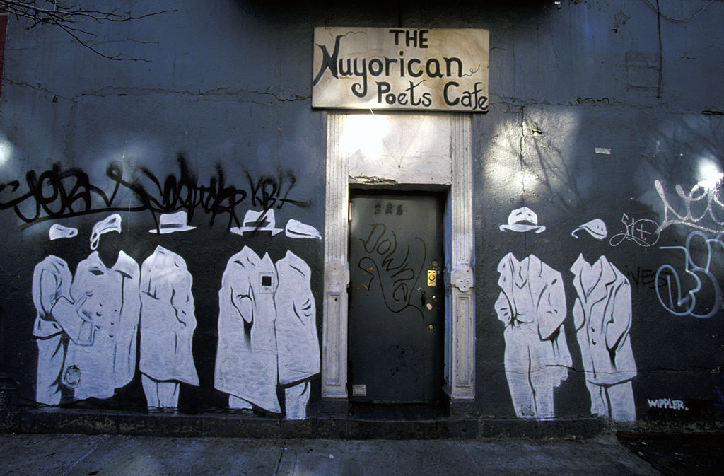 Entrance to the iconic Nuyorican Poets Cafe, surrounded by stenciled figures, in the East Village, on Jan. 1, 2000.