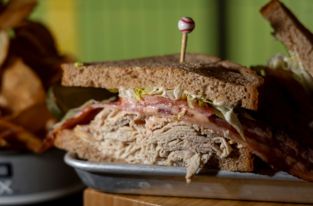 The Fowl Ball sandwich with roast turkey, hickory smoked bacon, lettuce, tomato, mayo and Louie dressing on wheat toast available at the Huntington Bank Stadium Club as the White Sox preview new food offerings Thursday, March 21, 2024, at Guaranteed Rate Field. (Brian Cassella/Chicago Tribune)