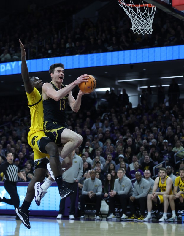 Northwestern guard Brooks Barnhizer (13) drives to the basket in the first half against Iowa on March 2, 2024, at Welsh-Ryan Arena in Evanston. (Chris Sweda/Chicago Tribune)