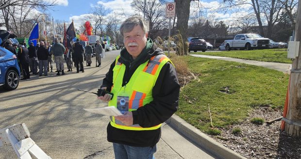 Steve Martin of St. Charles was one of dozens of volunteers who helped out Saturday during the St. Patrick's parade. (David Sharos / For The Beacon-News)