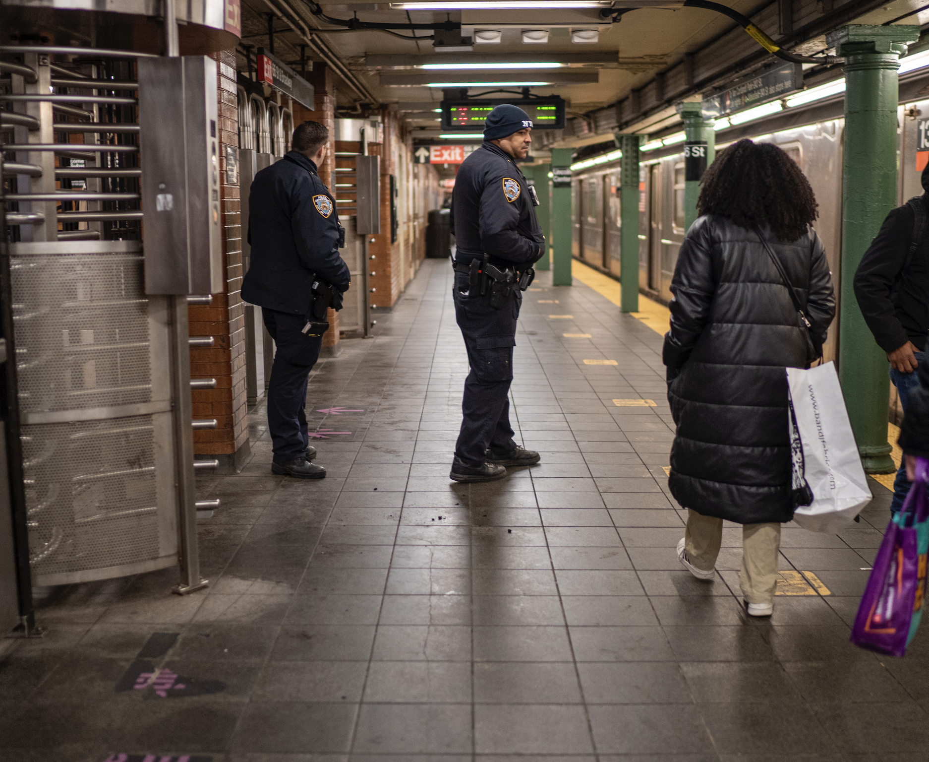 A stock image of police officers on a subway platform.