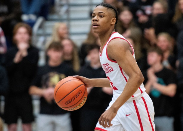 Crown Point's Kingston Rhodes moves the ball during the Class 4A Regional 2 championship game against Warsaw at Michigan City on Saturday, March 9, 2024. (Michael Gard/for the Post-Tribune)