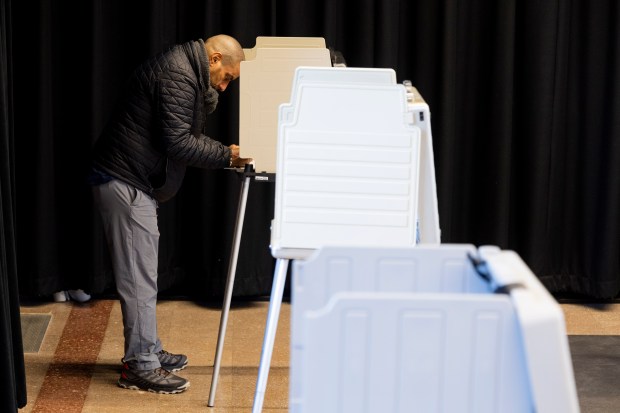 Hector Rivera votes during the Illinois primary election on March 19, 2024, at Chicago Filmmakers in Chicago. (Vincent Alban/Chicago Tribune)