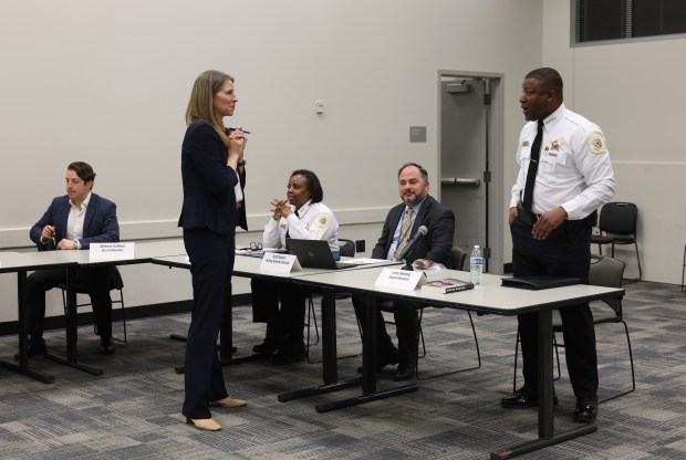 Andrea Kersten, chief administrator of the Civilian Office of Police Accountability (COPA), second from left, talks with Chicago police Supt. Larry Snelling, right, before a Chicago Police Board meeting at police headquarters, Feb. 22, 2024, in Chicago. (John J. Kim/Chicago Tribune)
