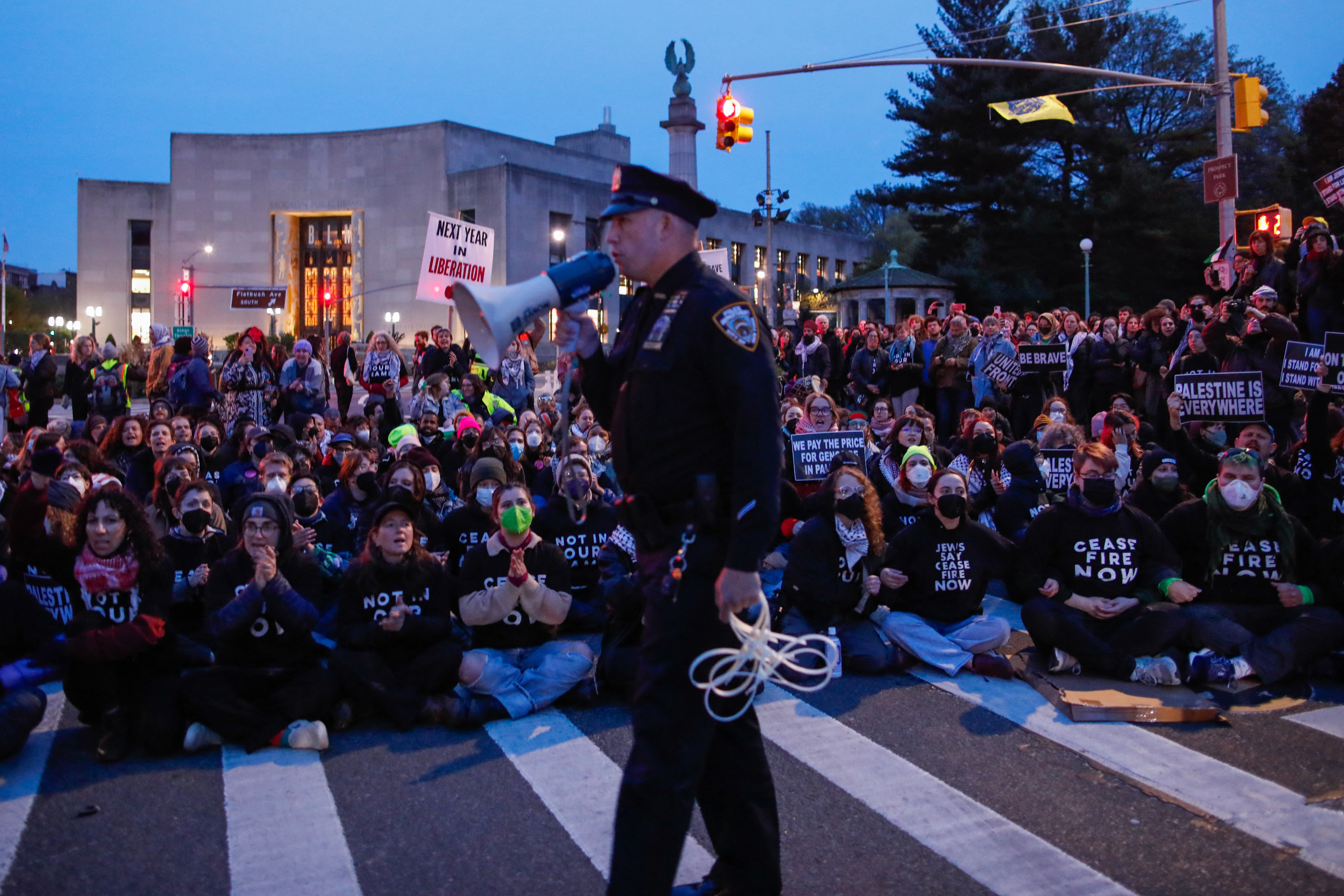 Protestors block the street near the home of U.S. Senate Majority Leader Chuck Schumer in the Brooklyn borough of New York during a demonstration by pro-Palestinian Jewish groups on the second night of Passover calling on Schumer to stop arming Israel amid its retaliatory assault on the Gaza Strip on April 23, 2024.