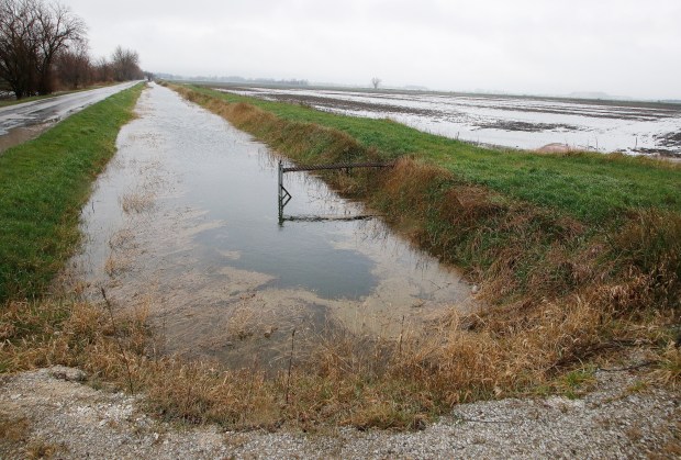 Due to the more than a week of rain, Lake County drainage ditches that feed into the Kankakee and Calumet rivers are close to overflowing their banks on Tuesday, April 2, 2024. (John Smierciak for the Post-Tribune)