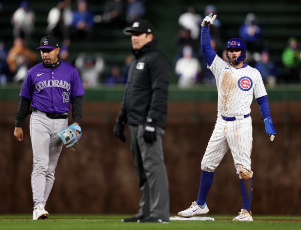 Chicago Cubs shortstop Dansby Swanson celebrates after stealing second base in the second inning of a game against the Colorado Rockies at Wrigley Field in Chicago on Wednesday, April 3, 2024. (Chris Sweda/Chicago Tribune)