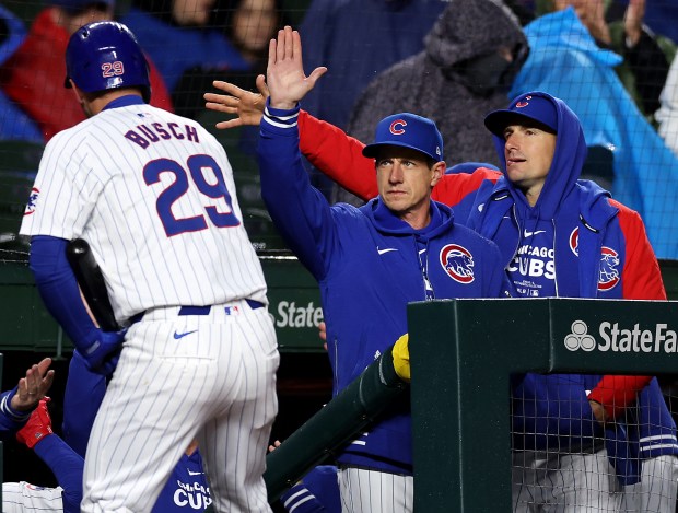 Chicago Cubs manager Craig Counsell celebrates after a run-scoring sacrifice fly by first baseman Michael Busch (29) in the second inning of a game against the Colorado Rockies at Wrigley Field in Chicago on Wednesday, April 3, 2024. (Chris Sweda/Chicago Tribune)