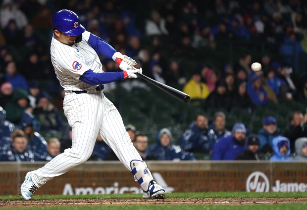 Chicago Cubs right fielder Seiya Suzuki (27) drives in two runs with a single in the second inning of a game against the Colorado Rockies at Wrigley Field in Chicago on Wednesday, April 3, 2024. (Chris Sweda/Chicago Tribune)