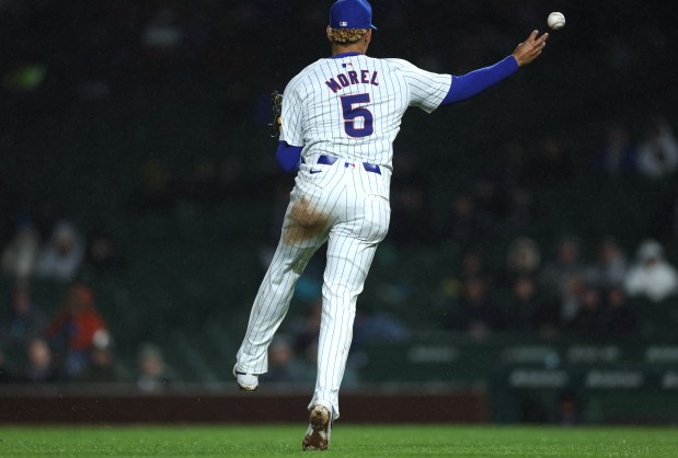 Chicago Cubs third baseman Christopher Morel (5) makes a throwing error in the sixth inning of a game against the Colorado Rockies at Wrigley Field in Chicago on Wednesday, April 3, 2024. (Chris Sweda/Chicago Tribune)