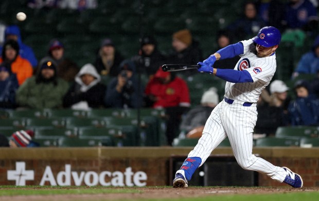 Chicago Cubs first baseman Michael Busch (29) singles in the sixth inning of a game against the Colorado Rockies at Wrigley Field in Chicago on Wednesday, April 3, 2024. (Chris Sweda/Chicago Tribune)