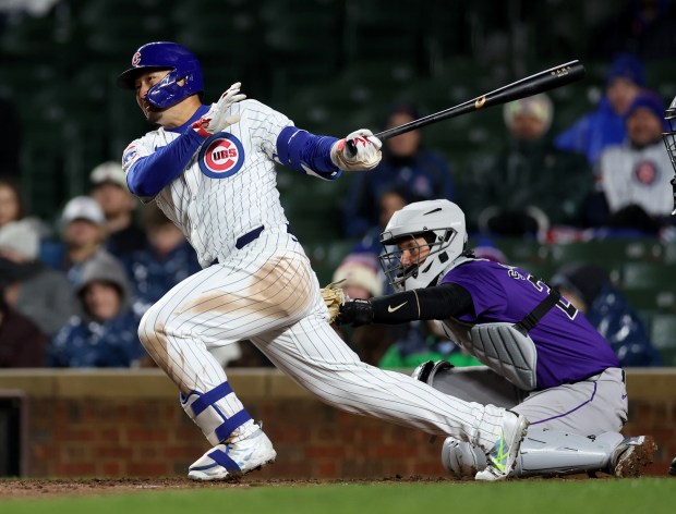 Chicago Cubs right fielder Seiya Suzuki (27) drives in the go-ahead run on a single in the 8th inning of a game against the Colorado Rockies at Wrigley Field in Chicago on Wednesday, April 3, 2024. (Chris Sweda/Chicago Tribune)