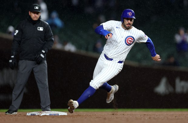 Chicago Cubs baserunner Mike Tauchman (40) rounds second base before scoring on a throwing error in the sixth inning of a game against the Colorado Rockies at Wrigley Field in Chicago on Wednesday, April 3, 2024. (Chris Sweda/Chicago Tribune)