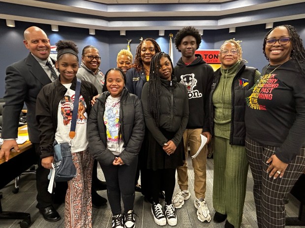 District 149 School Board members stand with middle school students in the Career and Technical Education during a recent meeting in Dolton. (School District 149)